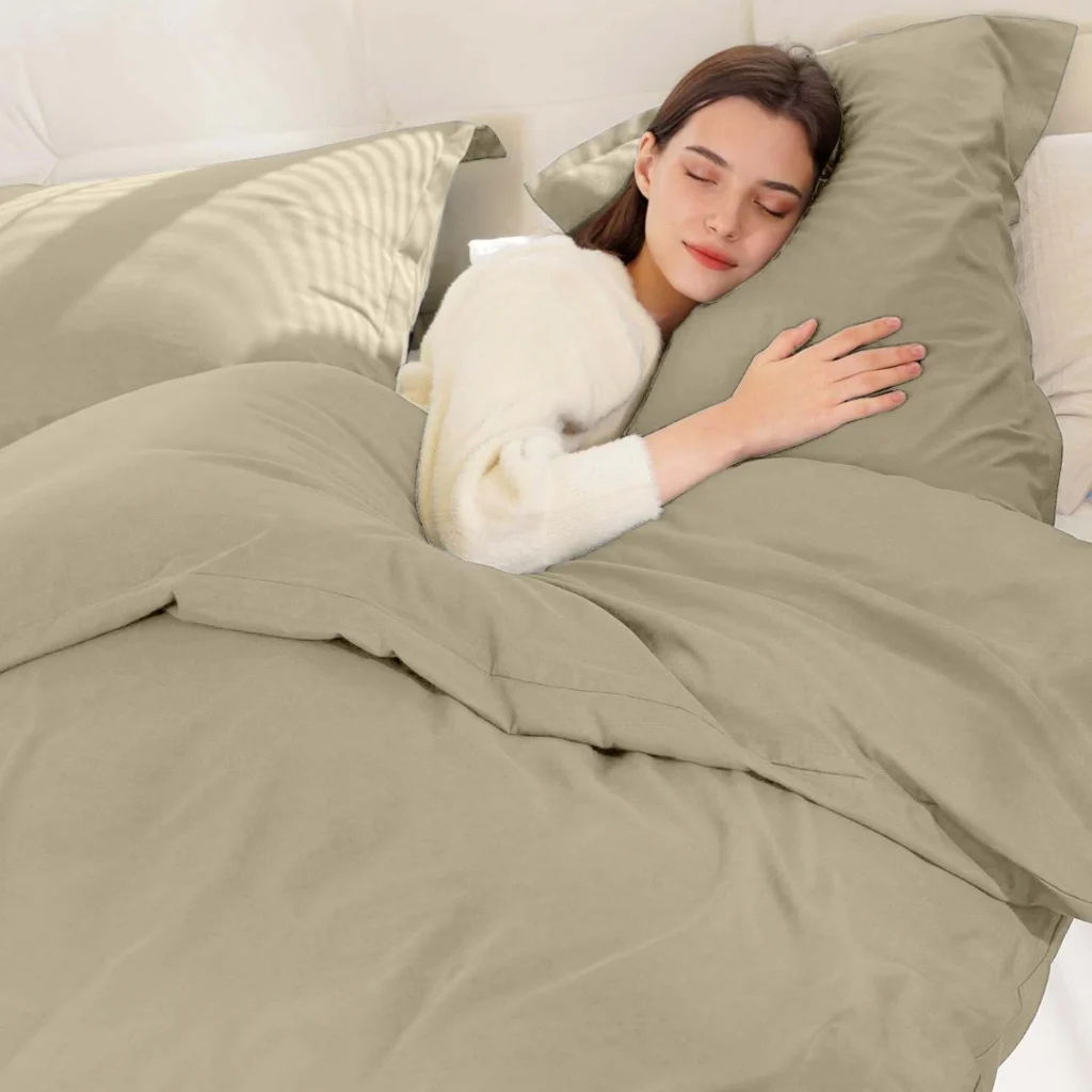 Silver reversible microfiber duvet cover set with two matching pillow shams on a neatly made bed