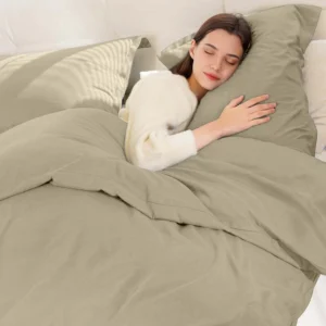 Silver reversible microfiber duvet cover set with two matching pillow shams on a neatly made bed